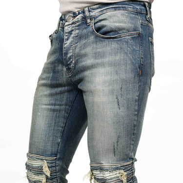 Ausgestellte Jeans mit Reißverschluss und Rippen am Knie. Blau